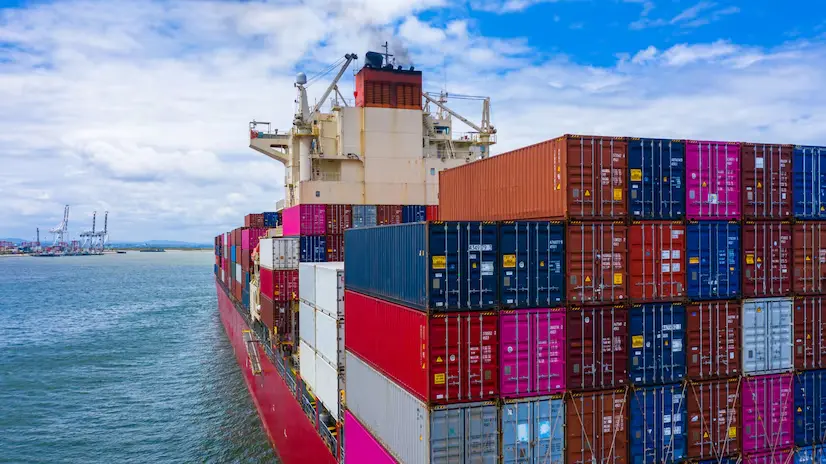 side view of container ship near port